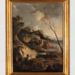 A framed painting depicting a coastal landscape with ruins and figures in the foreground.