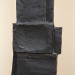 Detail of a bronze sculpture of an abstract form.