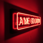 A hand-blown and hand-folded neon lettering, mounted on Dibond that reads "A me gli occhi".