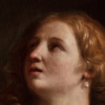 Detail of a painting depicting the face of a woman with long wavy blond hair.