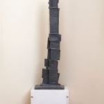 A bronze sculpture of an abstract form.
