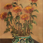 Oil painting of yellow and orange chrysanthemums with green leaves against a beige background in a green and yellow decorative vase positioned on a wooden surface.