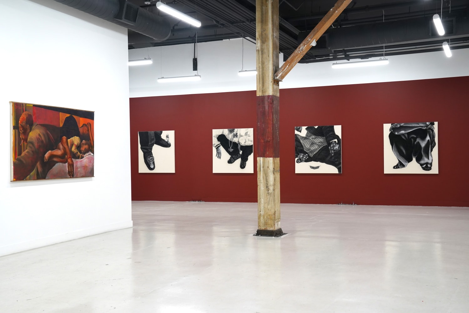 photograph of the gallery with paintings on the walls