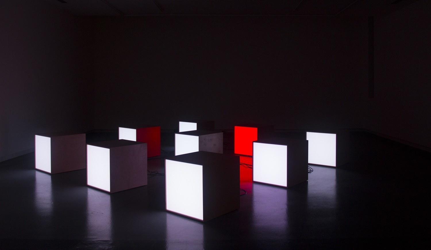 Floor Scatter Nine, 2015 9 wooden boxes, international LED DMX modules, black box Photo © Michiel Huijben