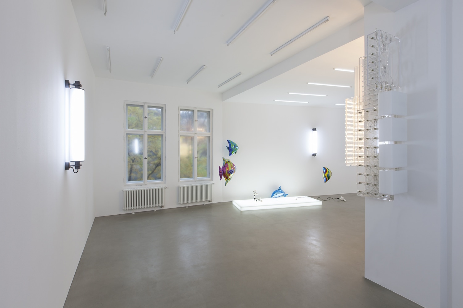 Flickering Light, 2013 (left and back) LED light, 1 programmed chip The light in the vertical lamps is programmed using...