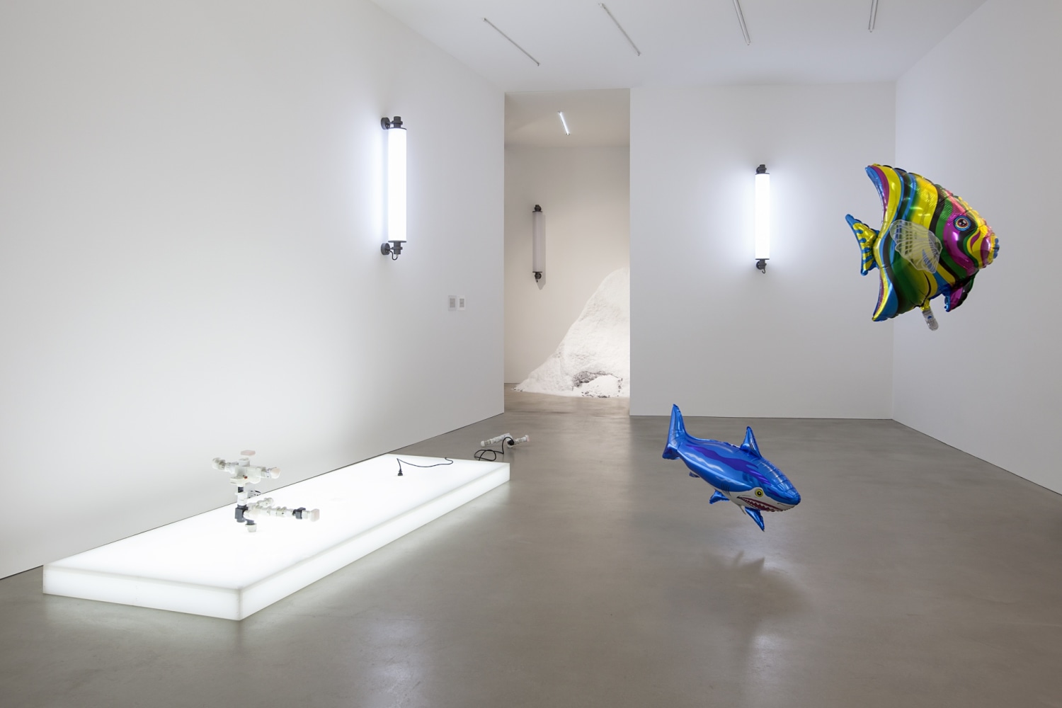 AC/DC Platform, 2013 (left) Opalescent acrylic glass podium, LED lights, 3 plugs, 2 AC/DC snakes Assembled from multiple adapters, plugs...