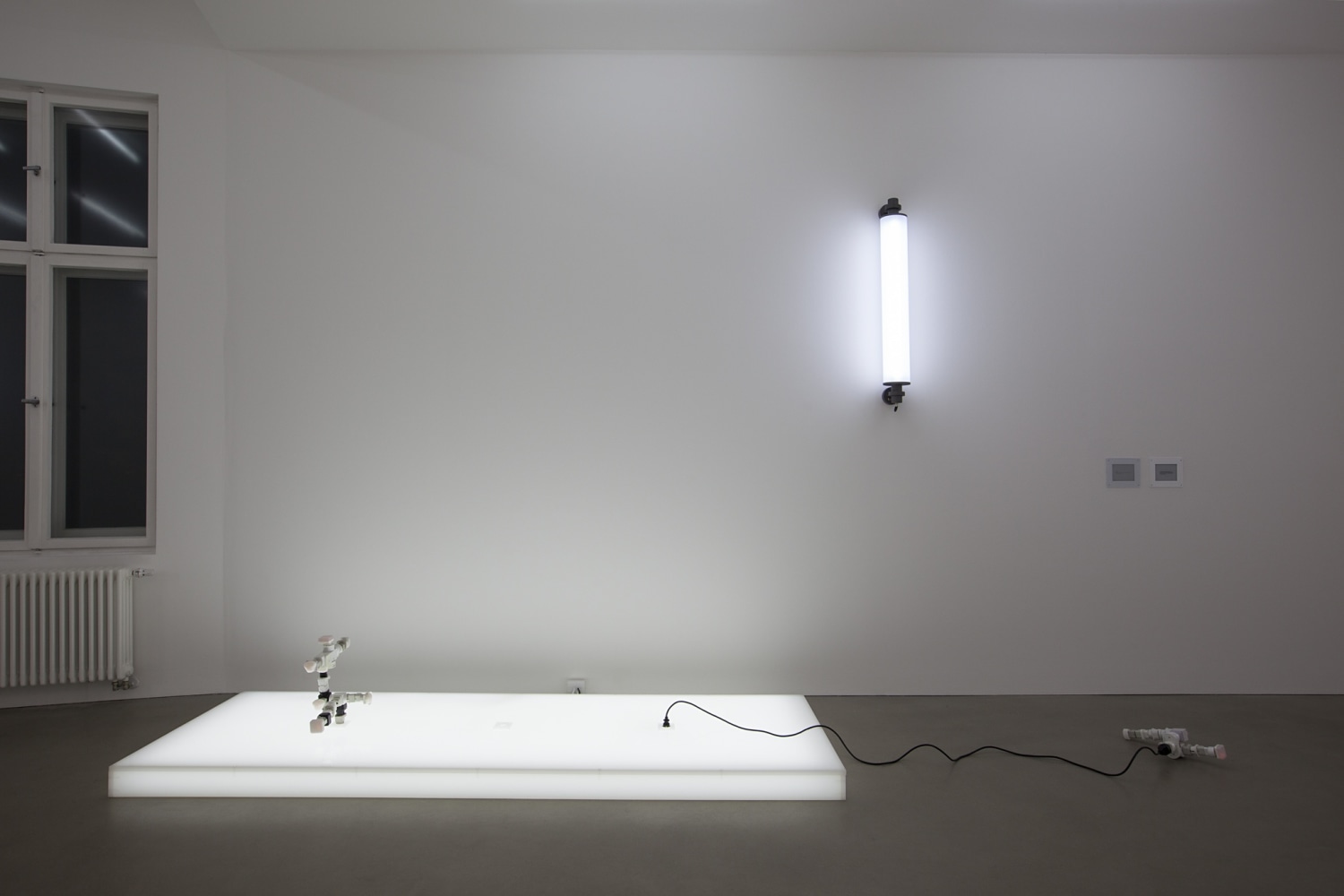 AC/DC Platform, 2013 (left) Opalescent acrylic glass podium, LED lights, 3 plugs, 2 AC/DC snakes Assembled from multiple adapters, plugs...