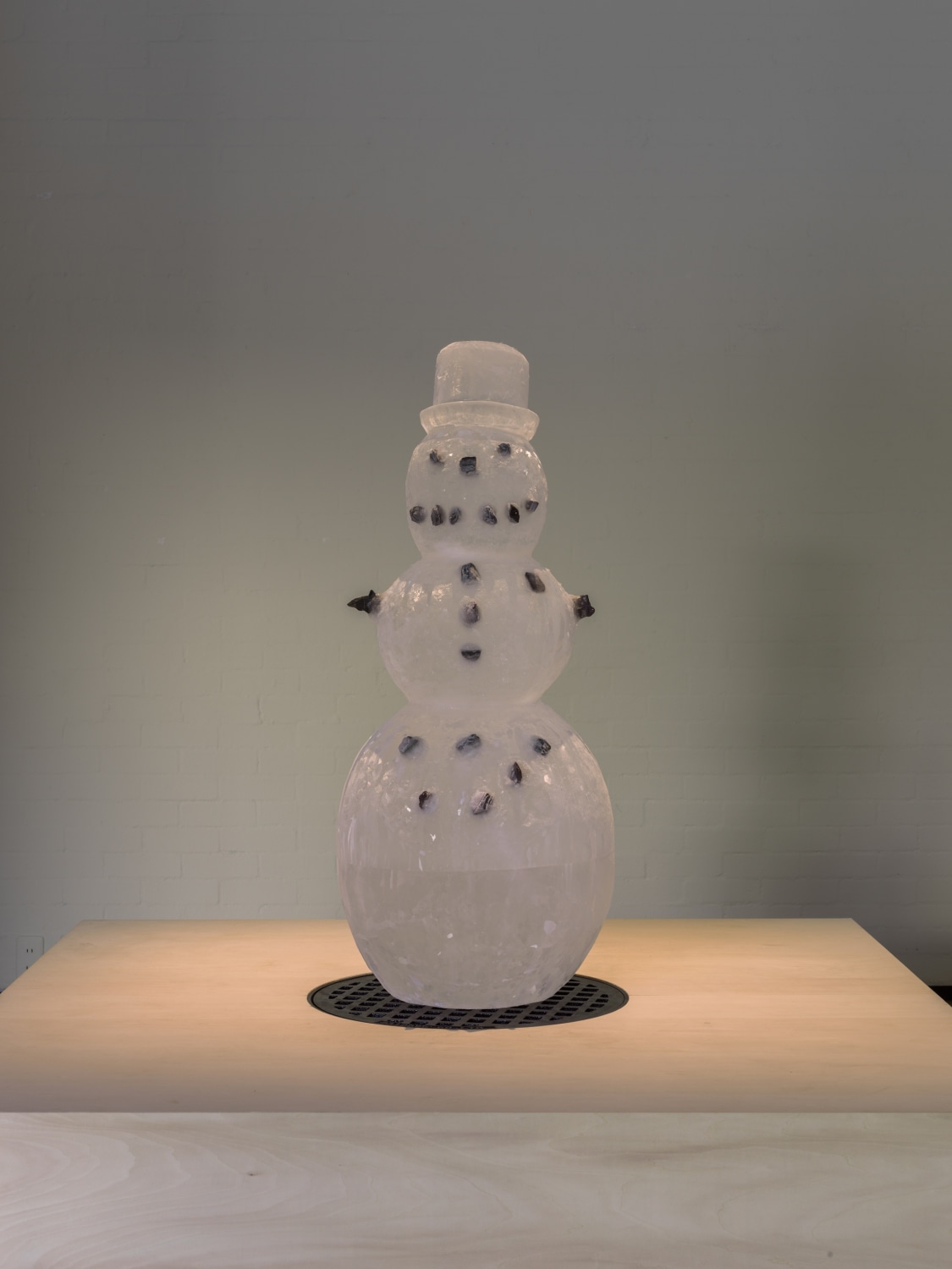 Iceman in Reality Park, 1995–2019 Sculpted ice, stones, plinth with a manhole, sound installation, protocol Dimensions variable Height: 117 cm...