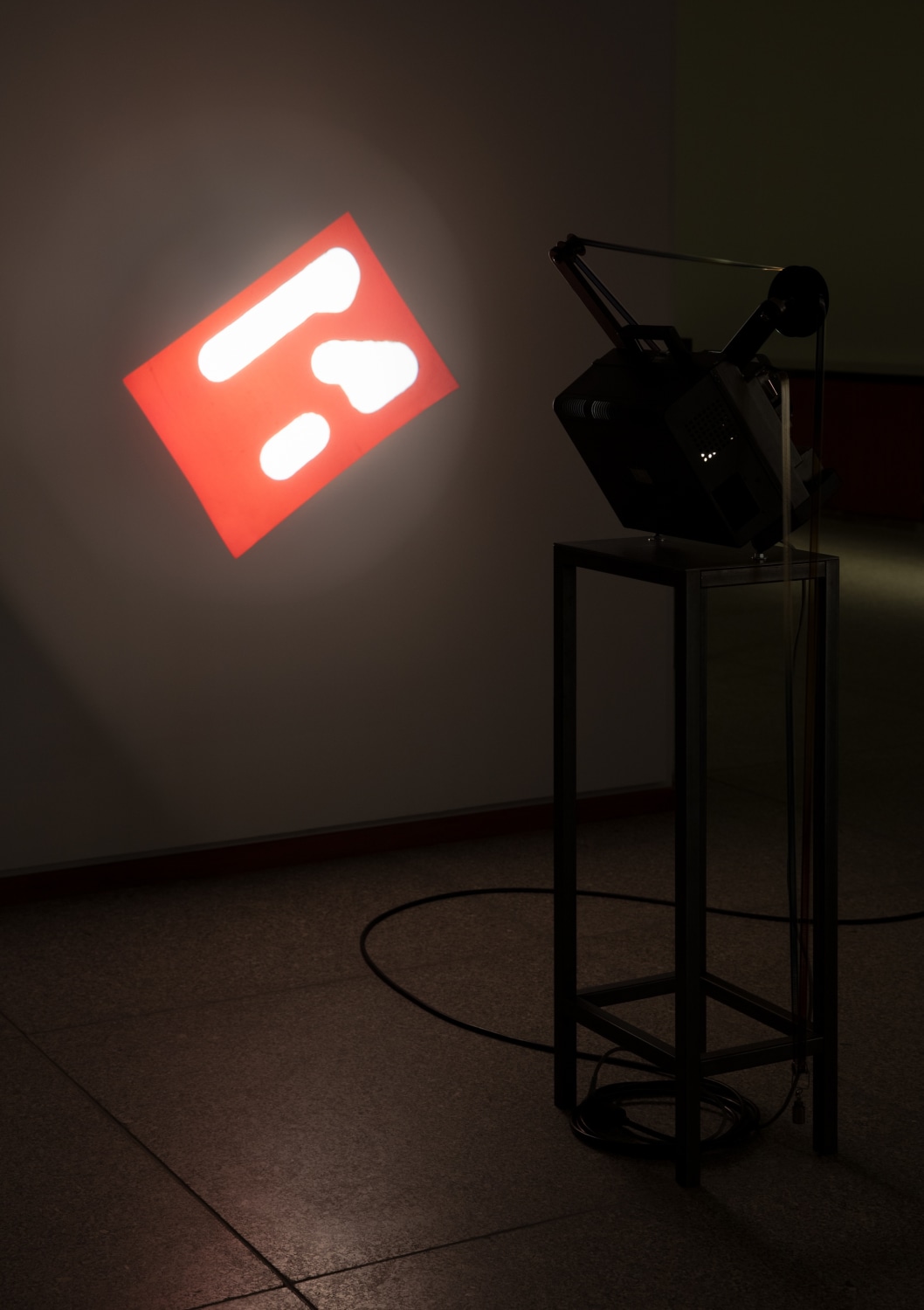 Rosa Barba The Long Poem Manipulates Spatial Organizations, 2014 Modified projector, plinth, stencil cut, 16 mm film (color) Dimensions variable...
