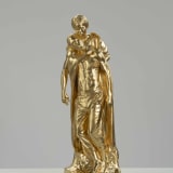 Tavares Strachan, Black Madonna (Alice "Mamcethe" Biko and Stephen Biko) Gold, 2022, bronze, gold leaf, 31 1/2 x 10 5/8 x 8 5/8 in., edition of 3 plus 1 artist's proof (#1/3), courtesy of the Artist and Perrotin (photo: © Jonty Wilde)