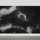 An image containing a chalk-on-blackboard work by Tacita Dean, depicting a storm
