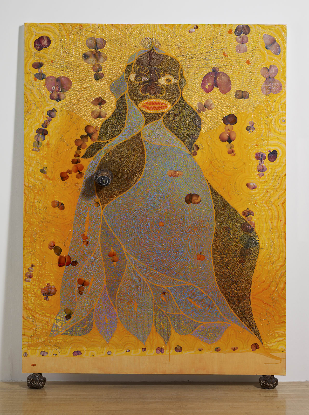 Chris Ofili's The Holy Virgin Mary, a mixed-media painting of a Black Madonna against a luminous yellow field