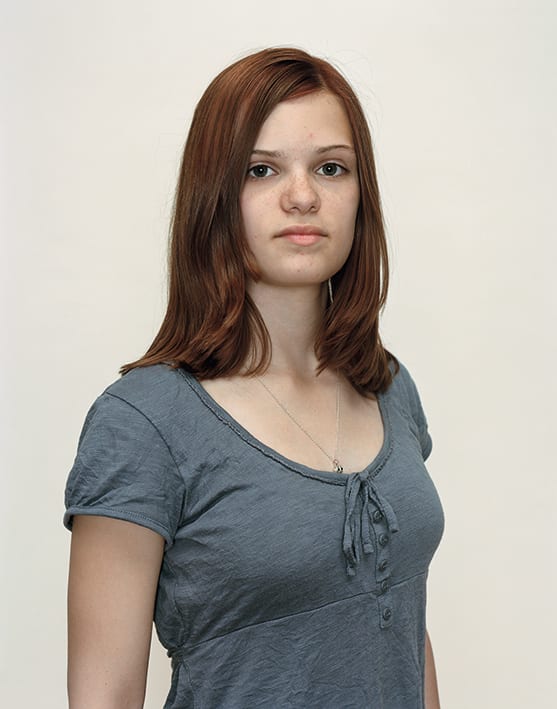 A Rineke Dijkstra portrait of a girl in a green shirt.