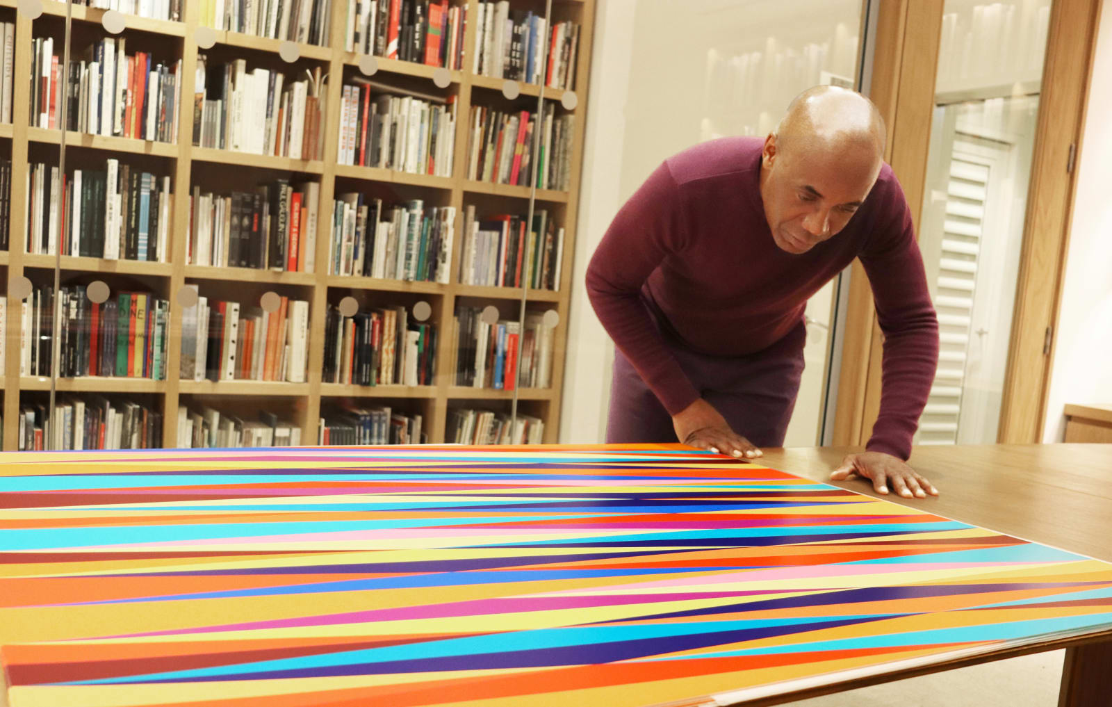 <h6 style="text-align: center;">Odili Donald Odita with his prints,<i> Firewall</i>, 2023.</h6><p style="text-align: center;">Photo: Darrell Tuffs</p>