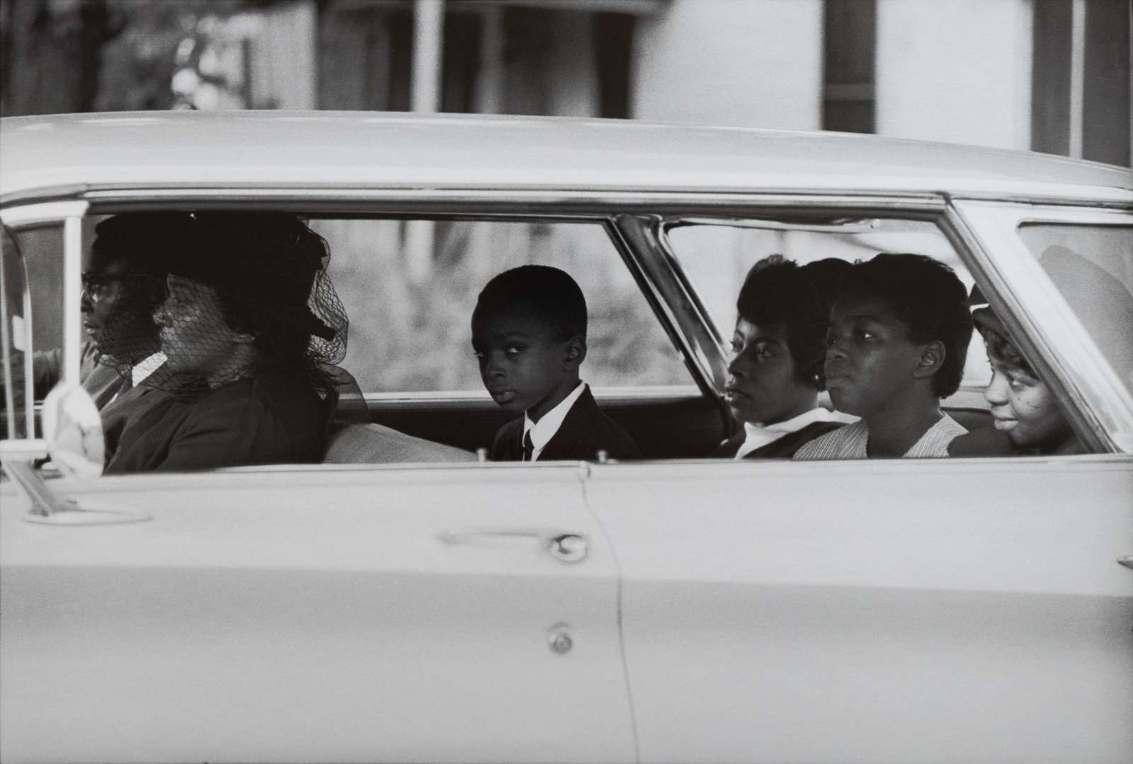 William Eppridge, The Chaney family as they depart for the burial of James Chaney, Meridian, Mississippi, August 7, 1964