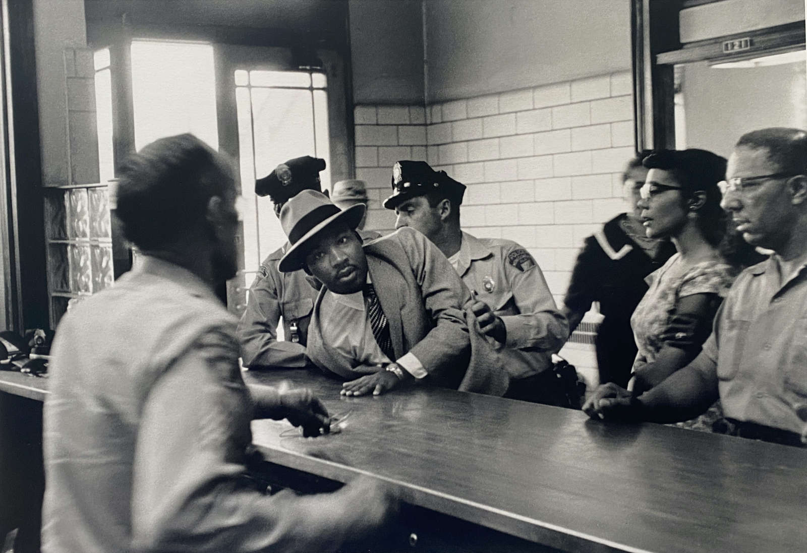 Charles Moore, Arrest of Martin Luther King Jr. at Police Department, Montgomery, Alabama, 1958