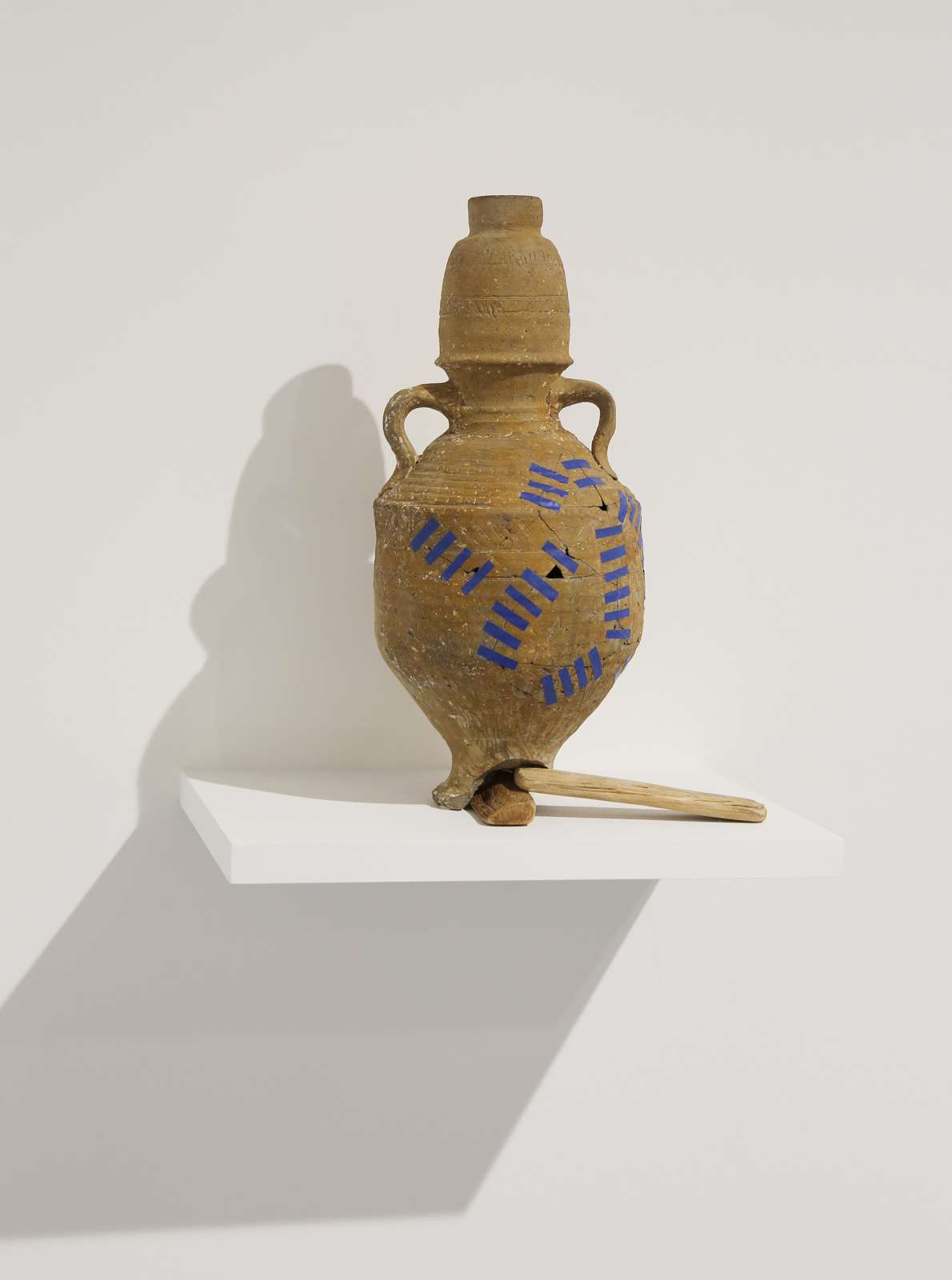 Ali Cherri, 'Grafting E', 2018. Jar with two handles from the Mediterranean Basin 900 1100 AD. Reparation tape wood, 34 X 30 X 20 cm. Courtesy of the artist and Galerie Imane Farès, Paris.