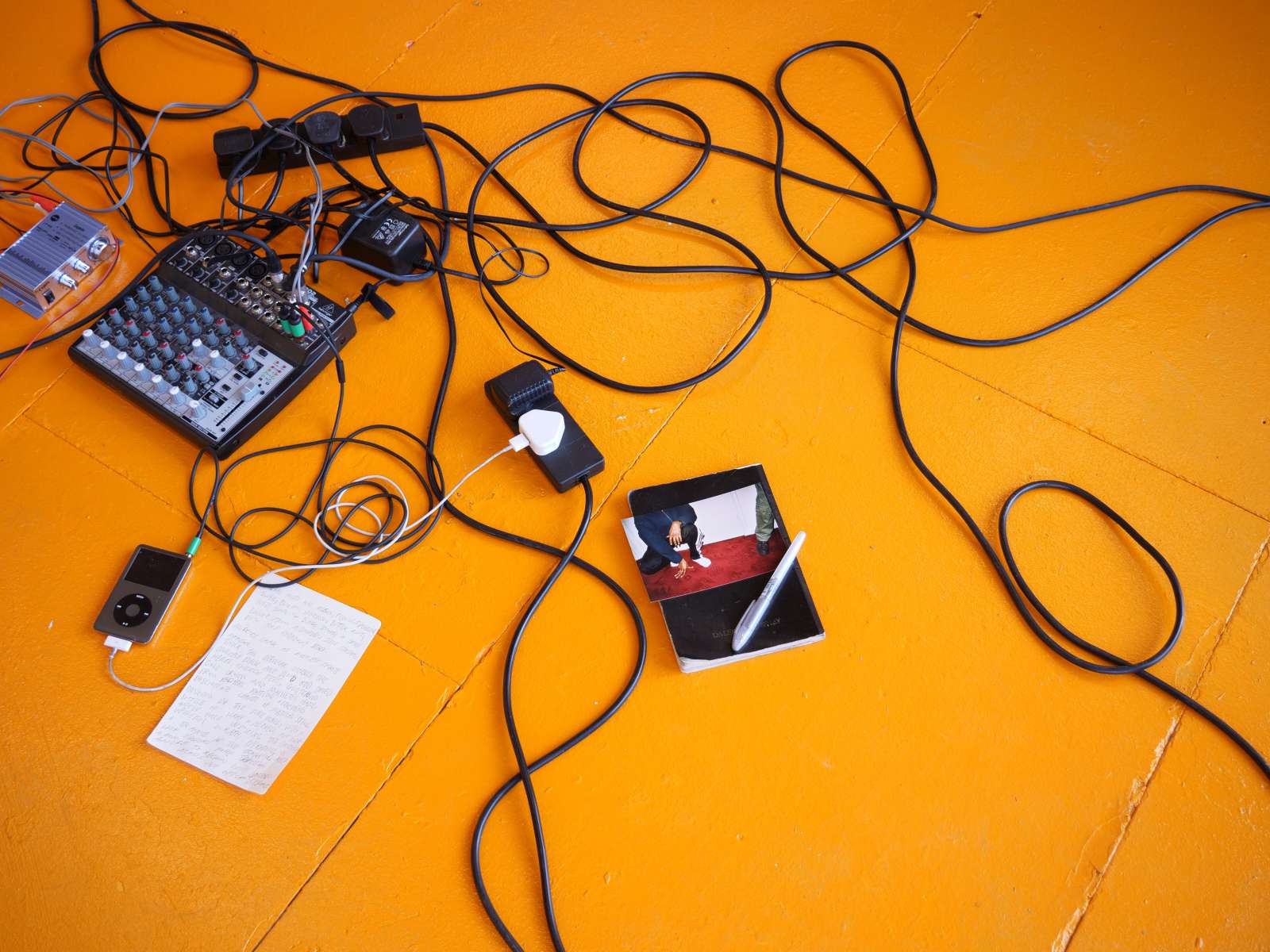 Tiffany Wellington, 'Arena' (detail), 2022, Audio, 3 wooden crates, cables, speakers, Behringer desk, amplifier, transducers, iPod classic, JCB yellow paint, journal, pen, photograph, miscellaneous items, Dimensions variable, 16:00 loop. Courtesy the artist and Public Gallery.