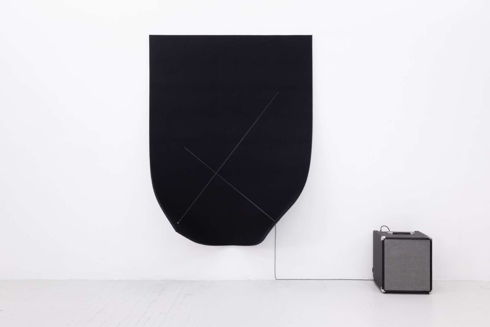 Naama Tsabar, 'Work on Felt (Variation 25) Black', 2021. Carbon fiber, epoxy, wood, felt, microphone, guitar amplifier, 195.6 x 151.4 x 55.9 cm.
