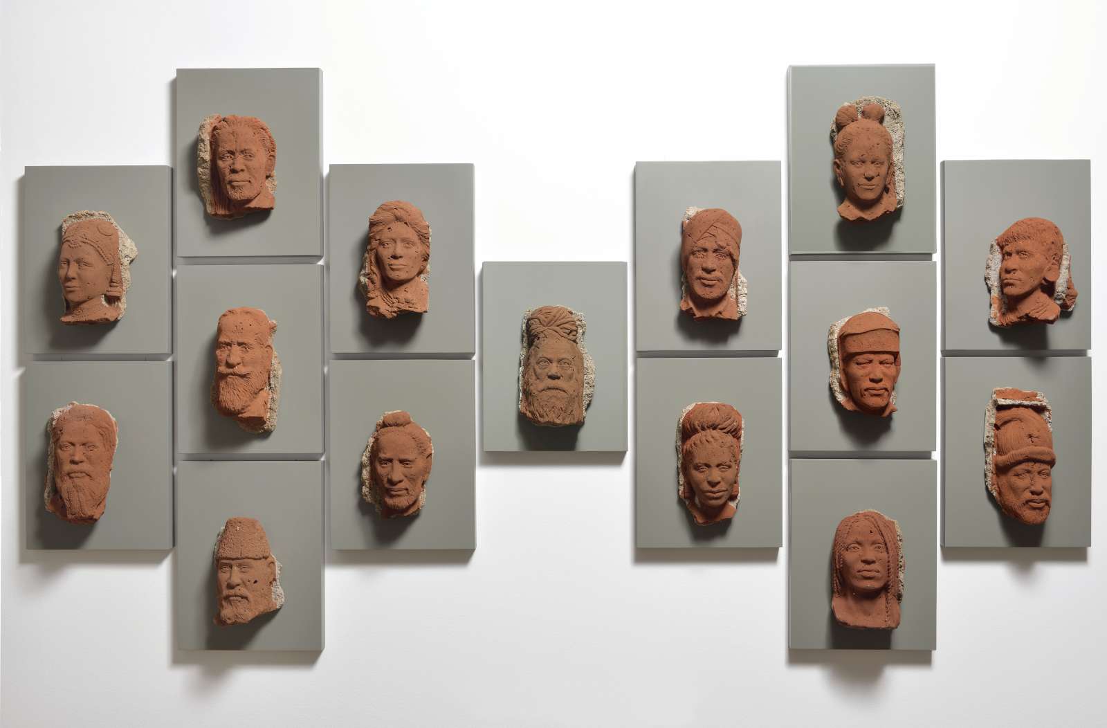 Girjesh Kumar Singh, 'Laaga Chunari Mein Daag (The Stained Robe)', 2018. Bricks and mortar mounted on panel, 110x196x10cm, 15 heads (34x26cm each piece).