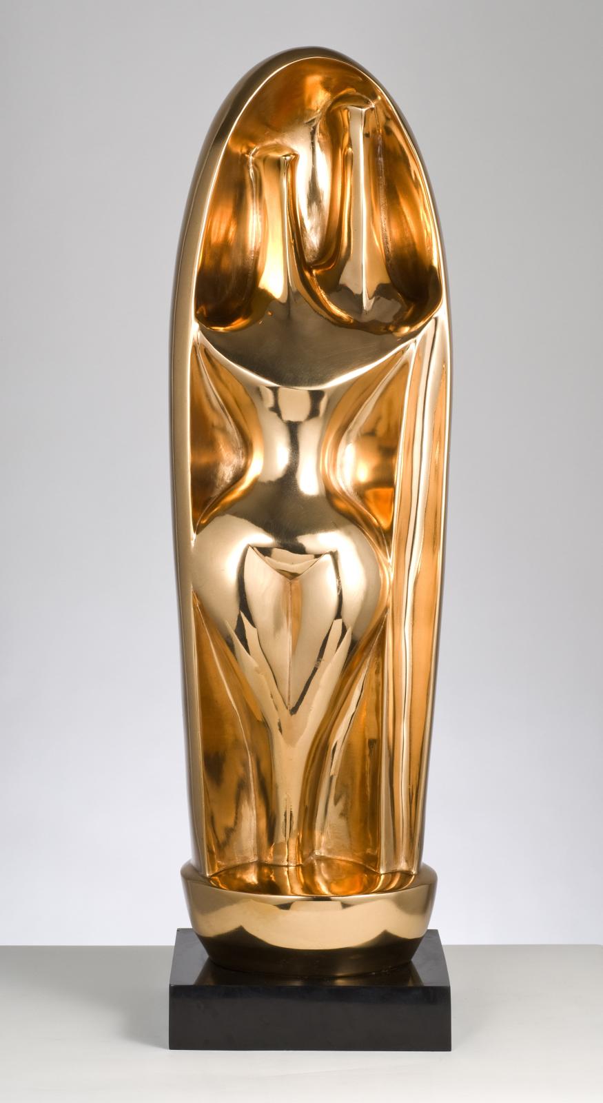 A polished bronze sculpture, two abstracted figures