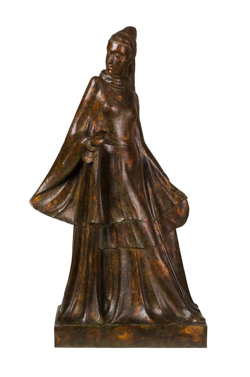 Bronze figure of a woman in a long flowing dress