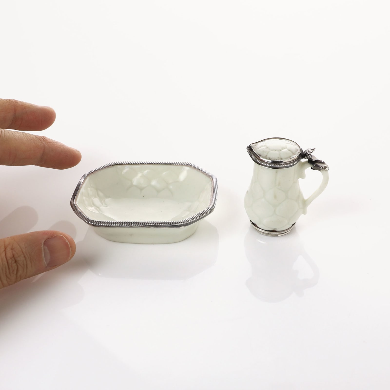 Saint-Cloud Porcelain, A Miniature Soft-Paste St. Cloud Porcelain Jug and Basin with silver mounts, circa 1730