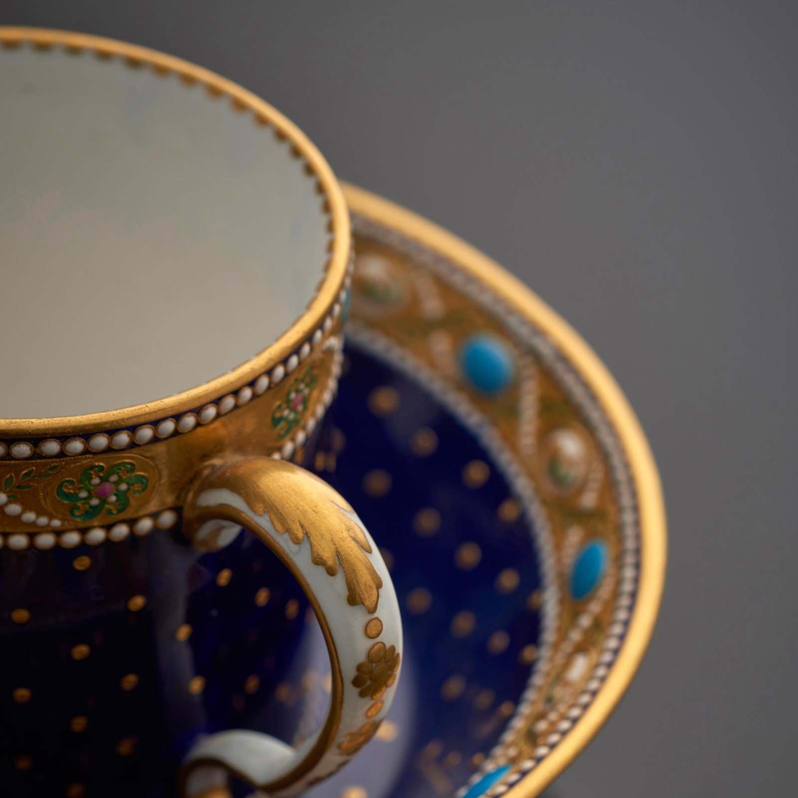 Sèvres Porcelain, A Sèvres Porcelain Cup & Saucer with ‘jewelling’ signed by Coteau, 1781