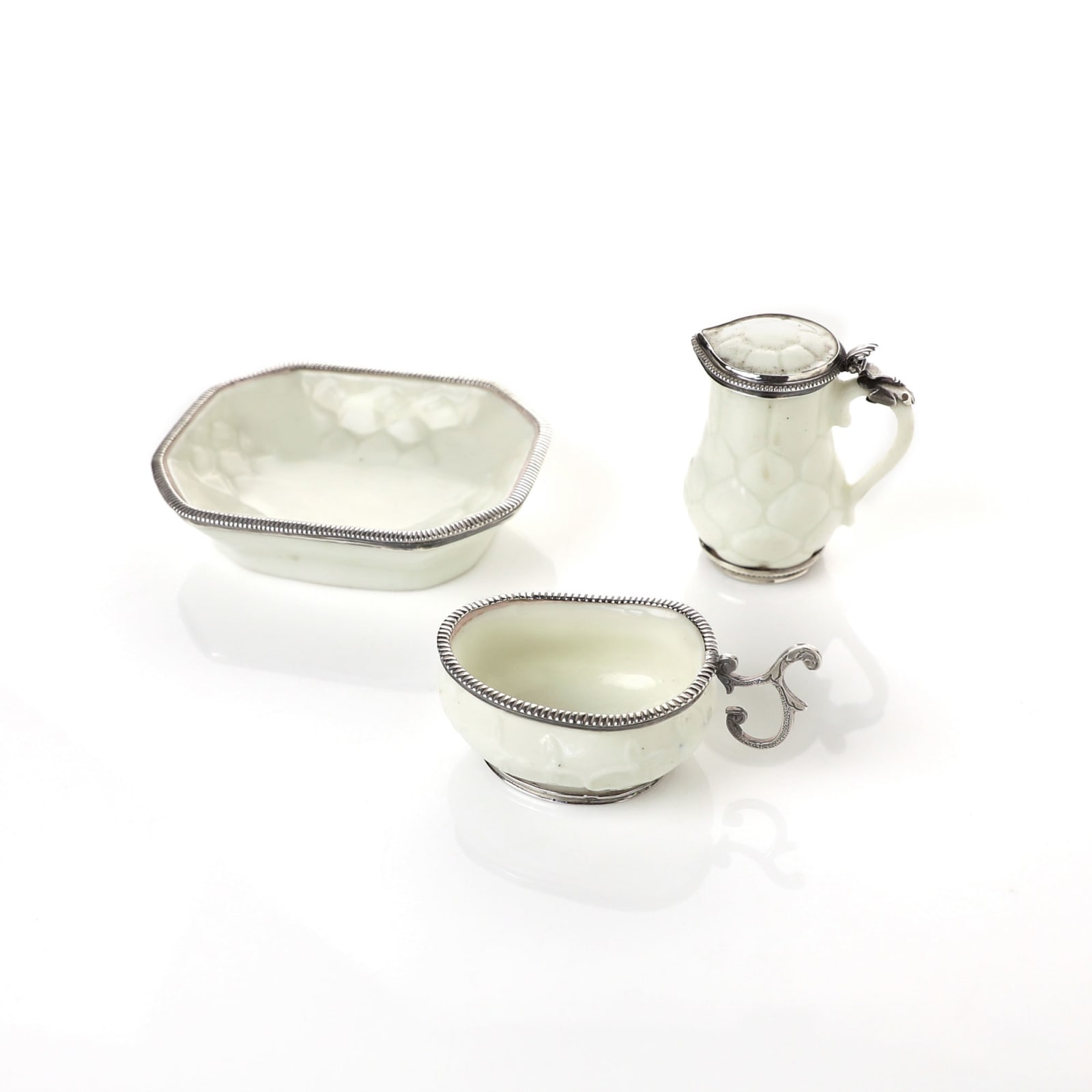 Saint-Cloud Porcelain, A Miniature Soft-Paste St. Cloud Porcelain Jug and Basin with silver mounts, circa 1730