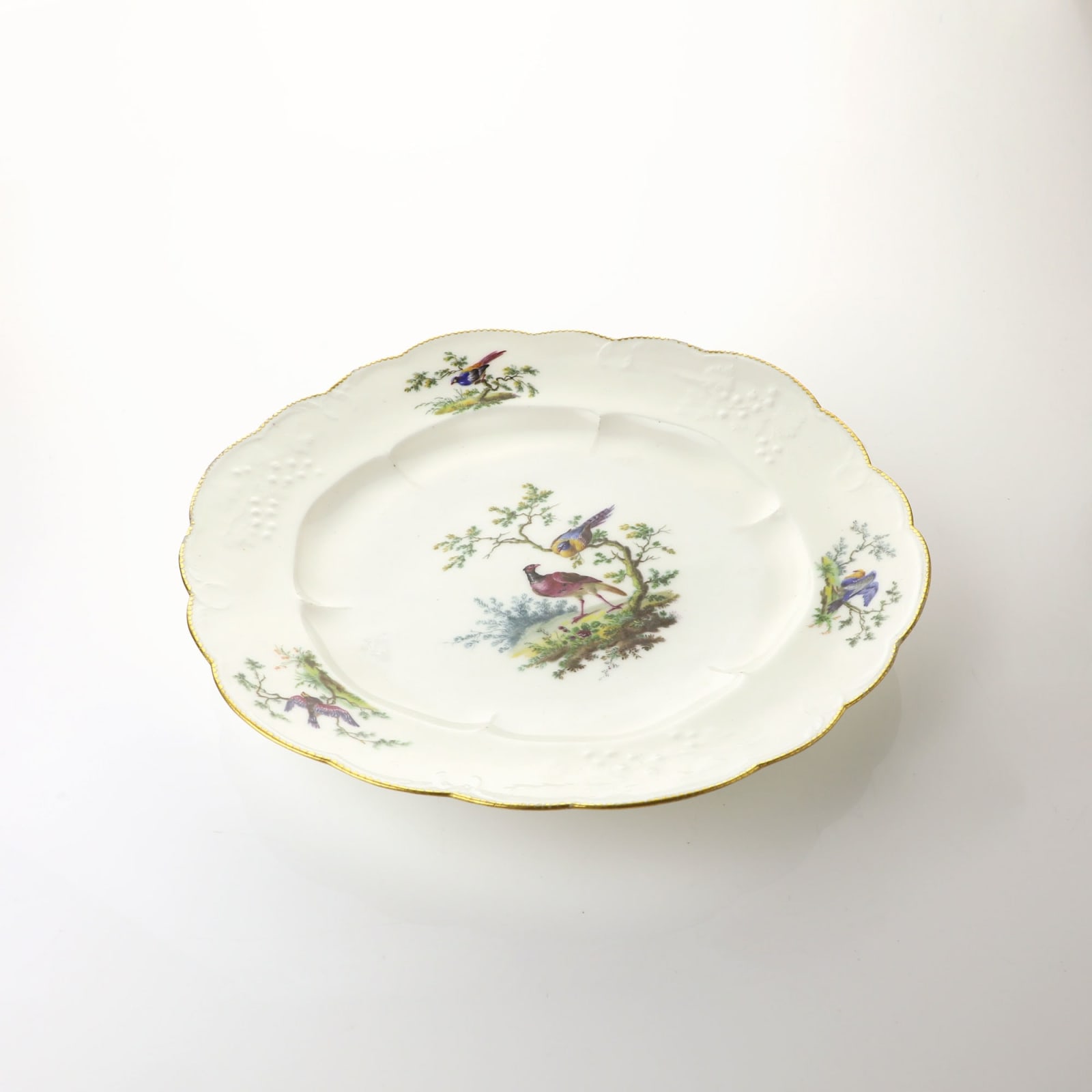 Sèvres Porcelain, A Soft-Paste Vincennes Porcelain Plate painted by Armand l'aîné , 1754