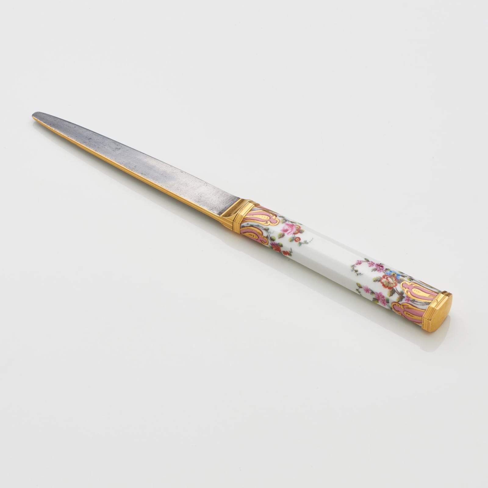Sèvres Porcelain, A Soft-Paste Sèvres Porcelain Knife handle with steel and gold blade, circa 1758-59