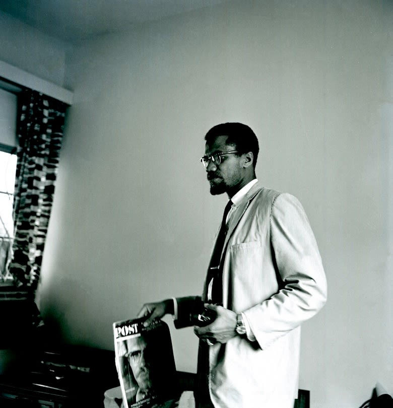 Mohamed (Mo) Amin, A candid shot of Malcolm X in his hotel room in Dar es Salaam, Tanzania, 1964