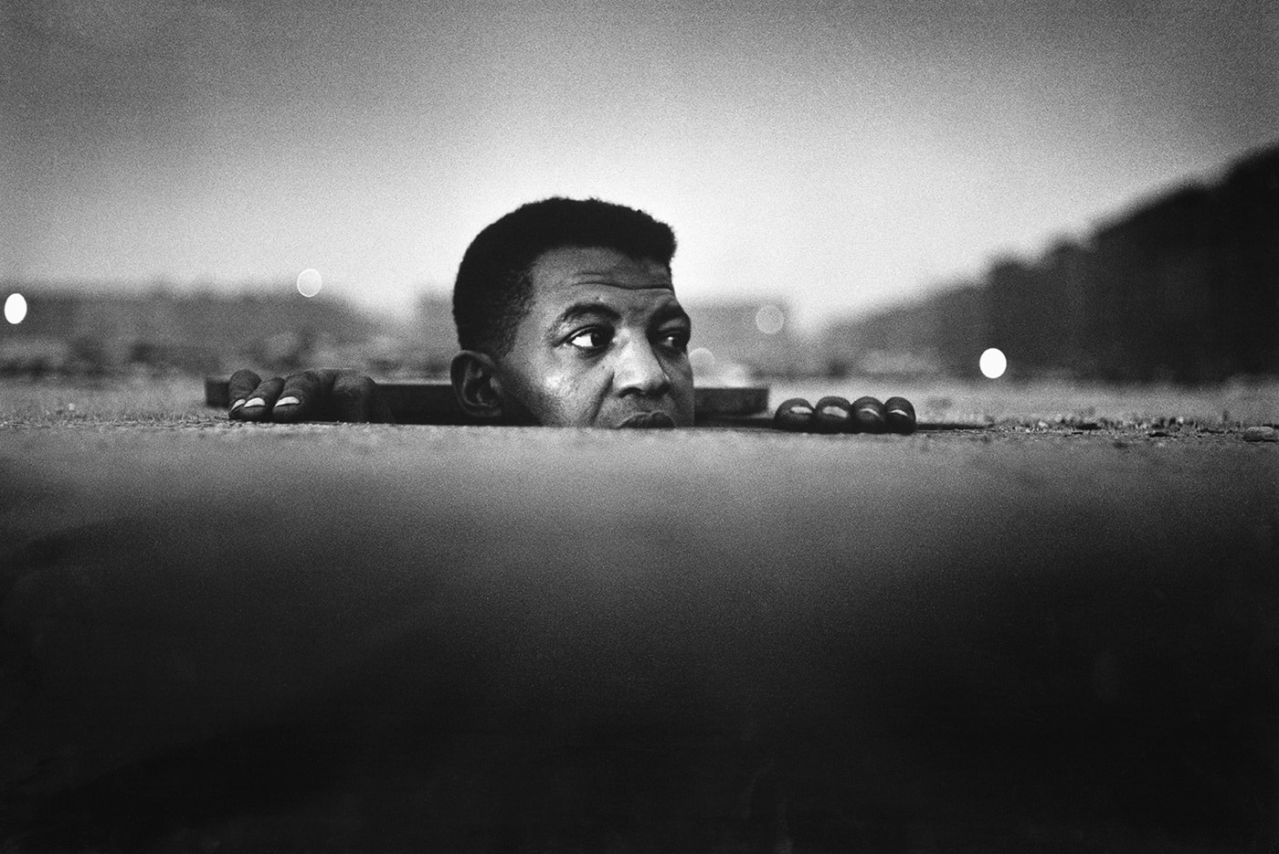 Gordon Parks, Man Emerging, Harlem, New York, 1952
