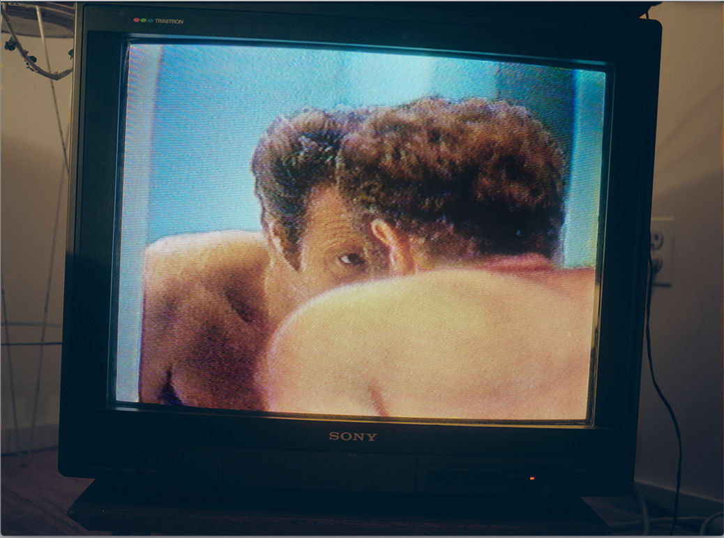 Judy Linn print depicting television monitor with figure hunched in mirror