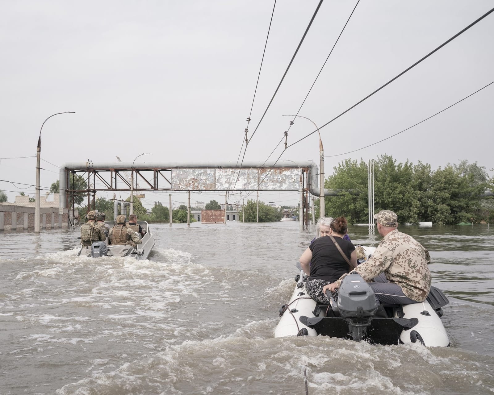 Johanna-Maria Fritz, Volunteers Viktor, Oleksandr and fellow volunteers help evacuate Maria and her daughter Svitlana from their home, 2023