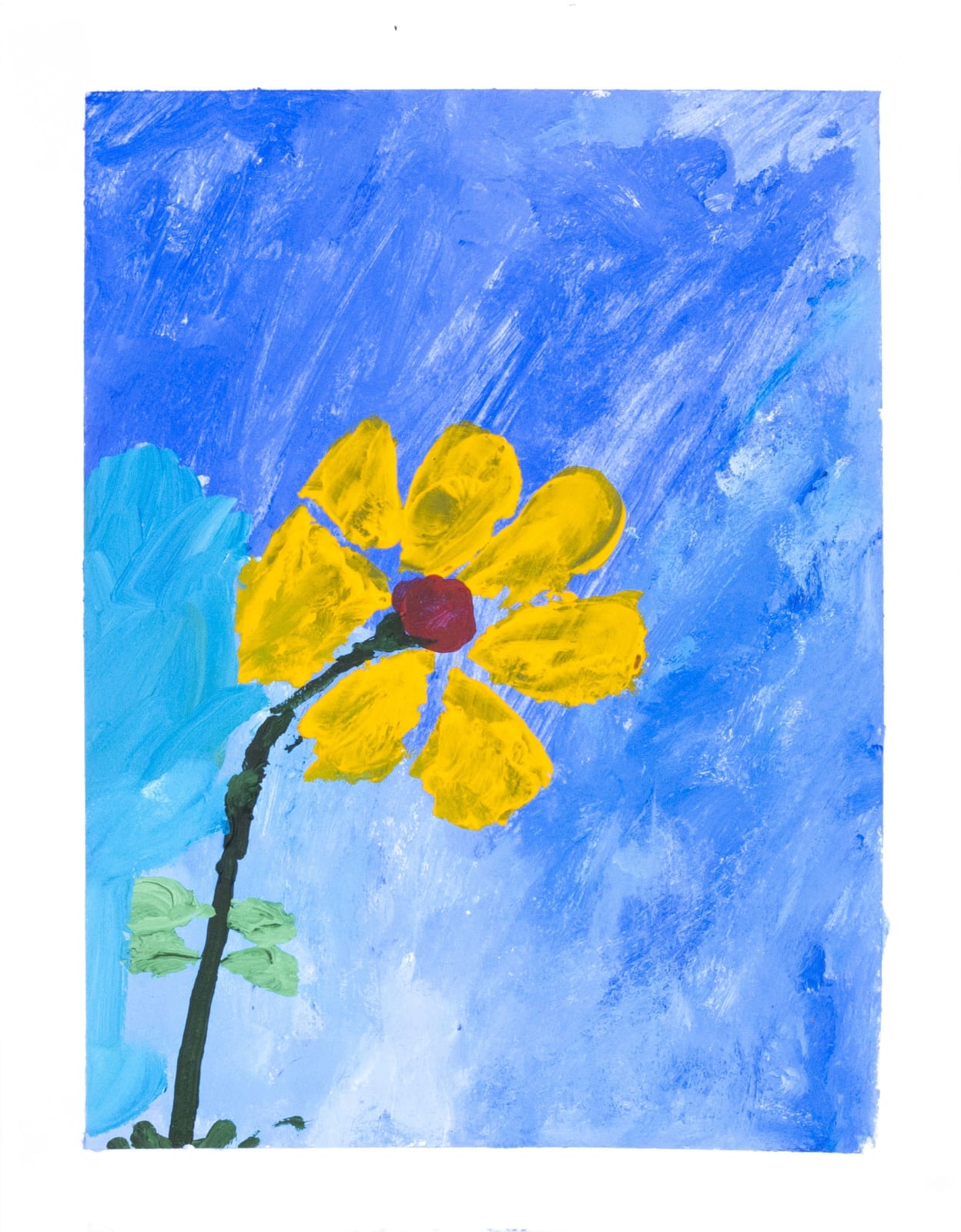 A flower with yellow petals against a blue sky