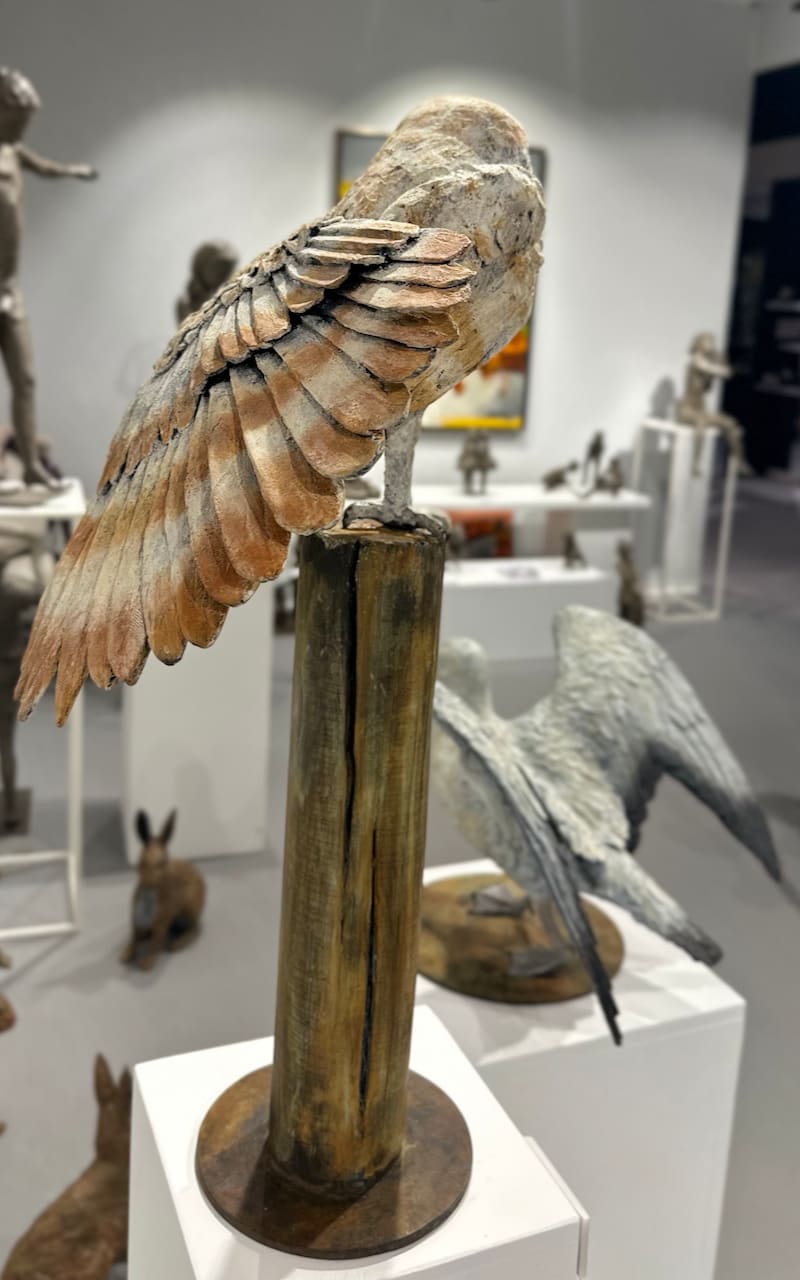 bronze sculpture, burrowing owl bronze, Marie Thys Belgian wildlife artist, ochre and off-white patinated bronze, owl standing on one leg, animal sculpture, contemporary art, garden sculpture, fine art piece, collectible bronze, outdoor mounting system, Art Thema Gallery
