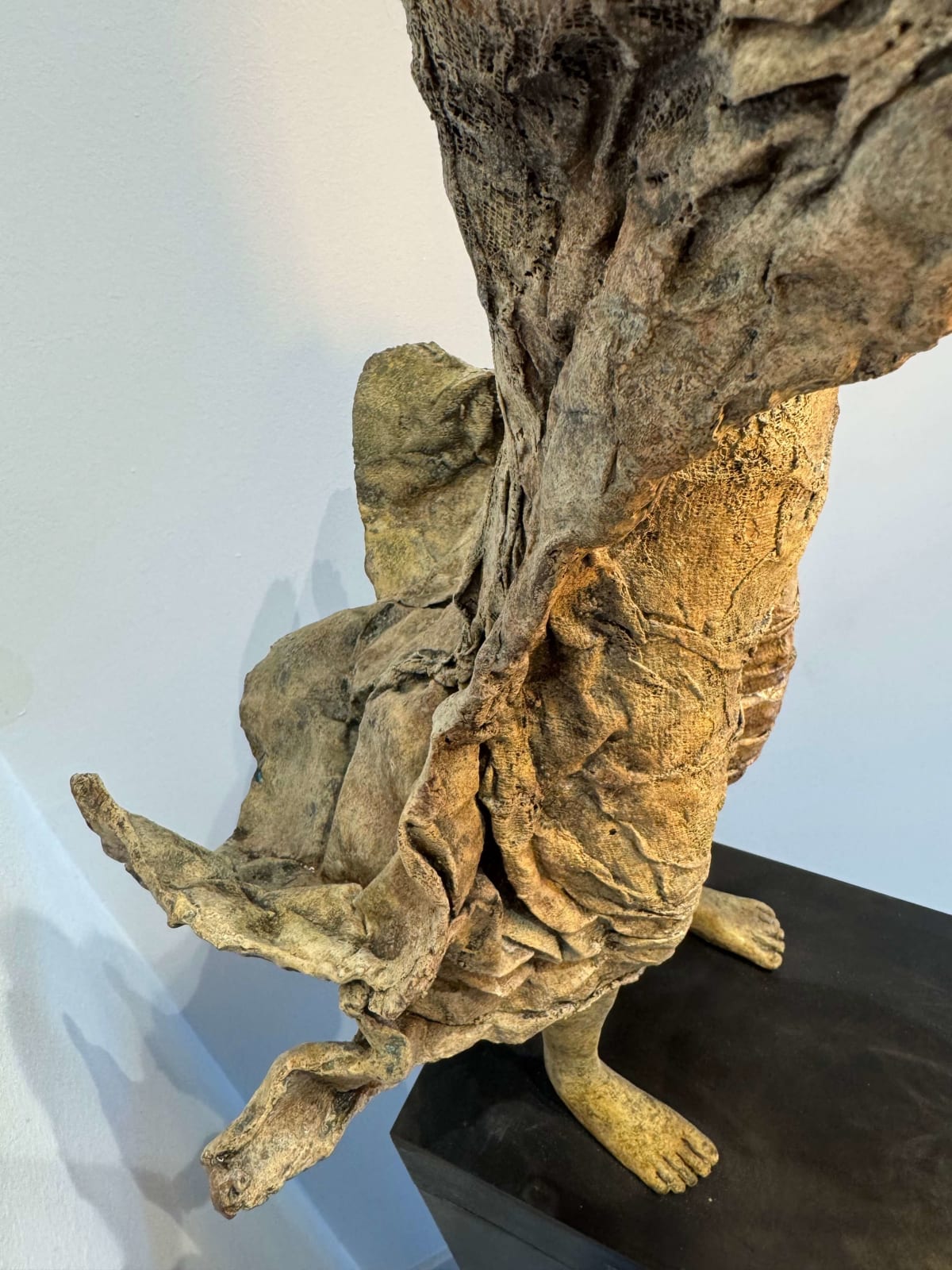 Visionary XL with light boy sculpture bronze sculpture of Lieven d'Haese garden sculpture boy opening arms to light up a light bulb in his hands with imagination magic dream contemporary art sculpture light interior design at Art Yi gallery in Brussels