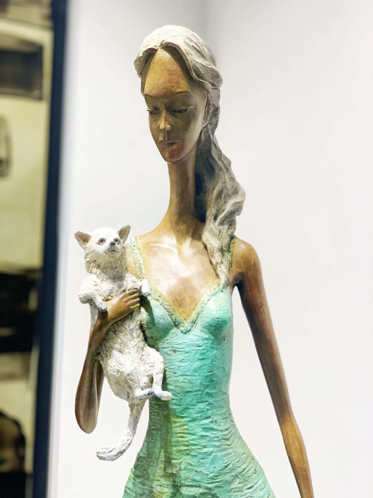 hollywood boulevard hedwige leroux a beautiful and fine contemporary city girl woman bronze sculpture with a little dog in her arm walking on the street