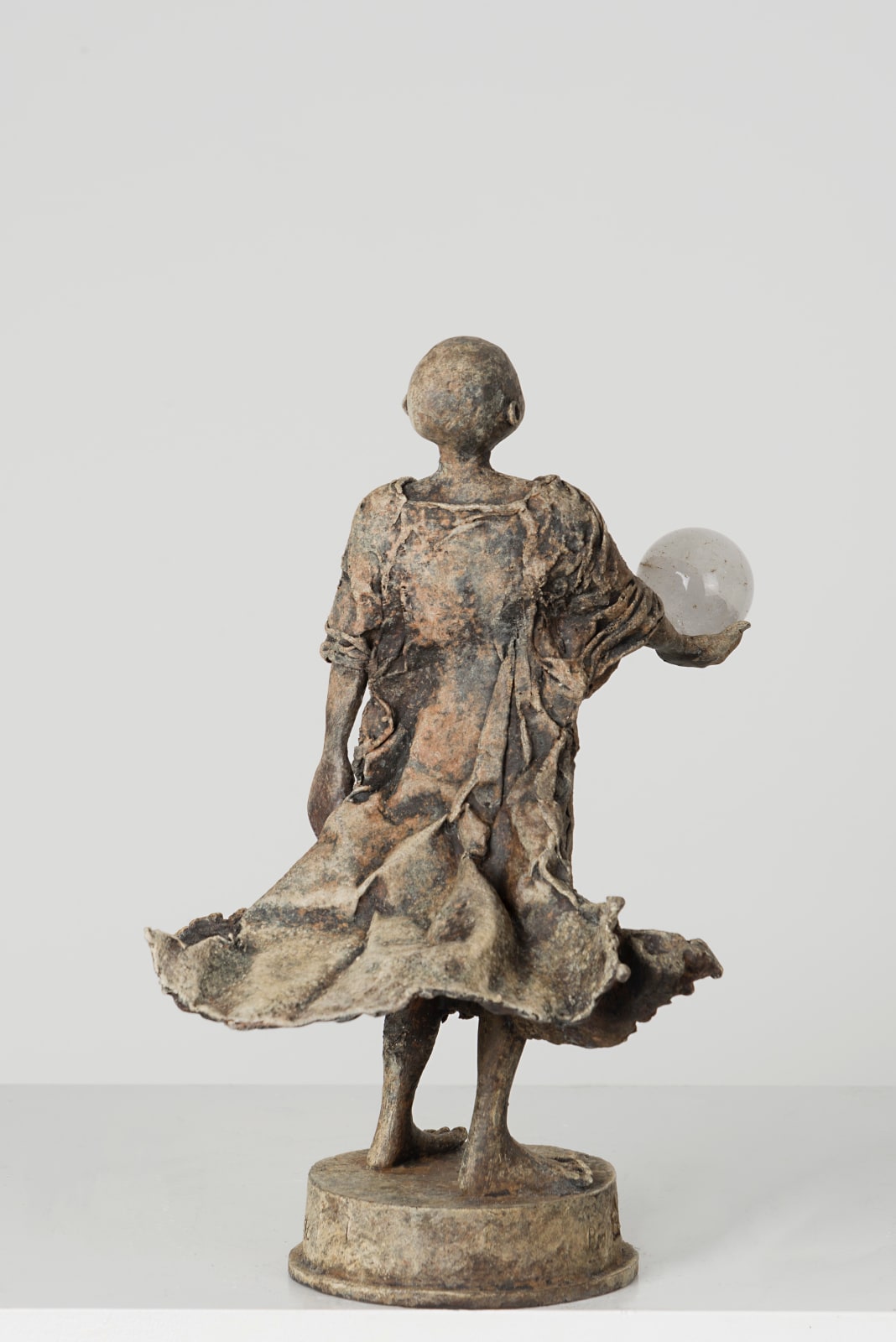 Visionary lieven d'haese contemporary bronze sculpture a boy holdiing a crystal ball sculpture of imagination Art Yi child sculpture childhood dream art gallery in brussels