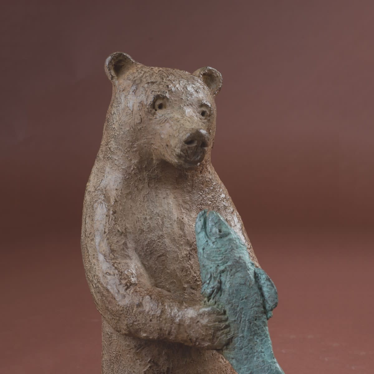 Sophie Verger bear and fish cute smiling bear sculpture carring a blue fish animal sculpture bronze sculpture Art Yi gallery Brussels art gallery