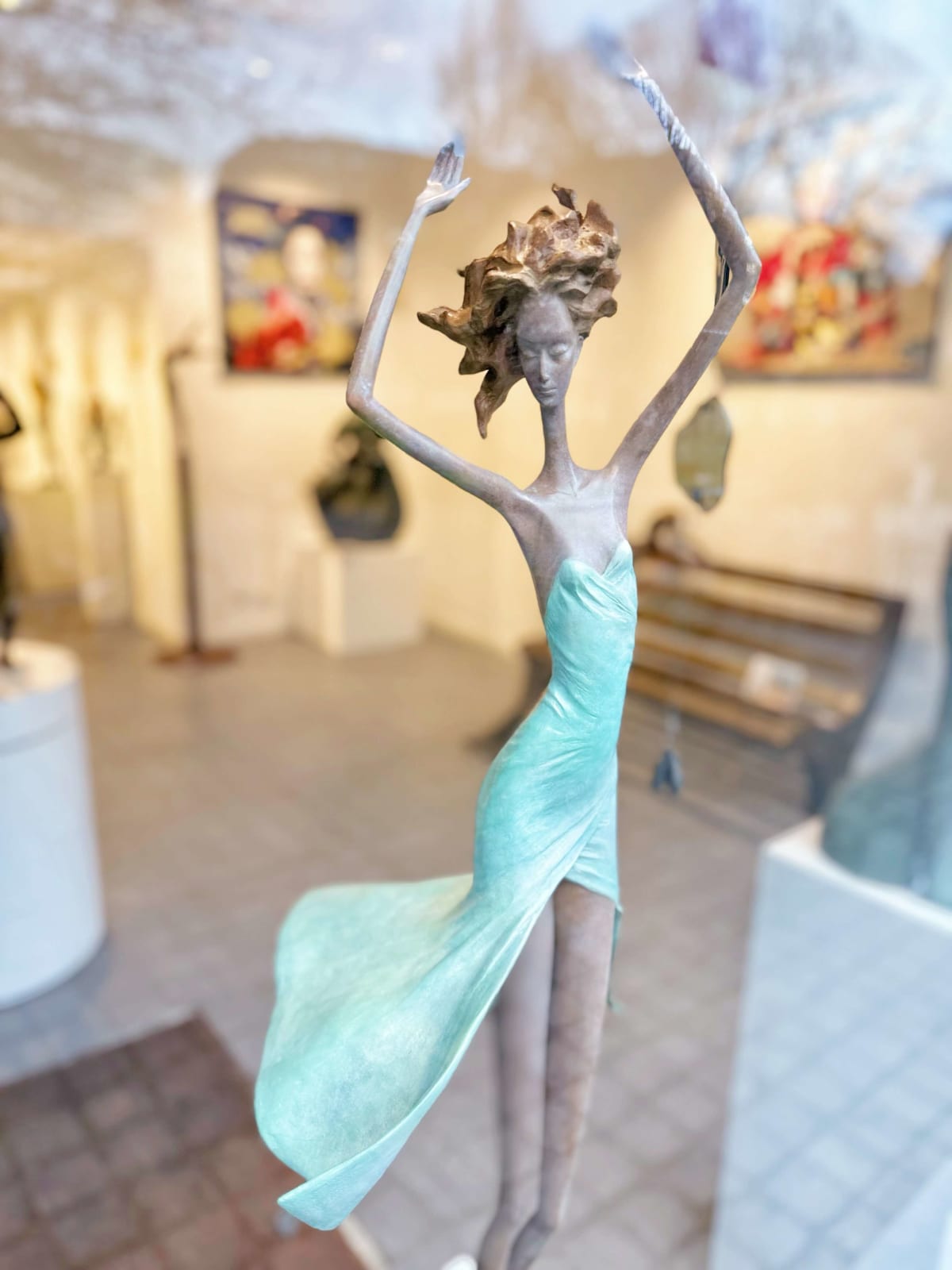 Moonlight dancing girl sculpture of Hedwige Leroux contemporary bronze sculpture dancer woman sculpture a girl in a green dress dancing freely Art Yi gallery in Brussels