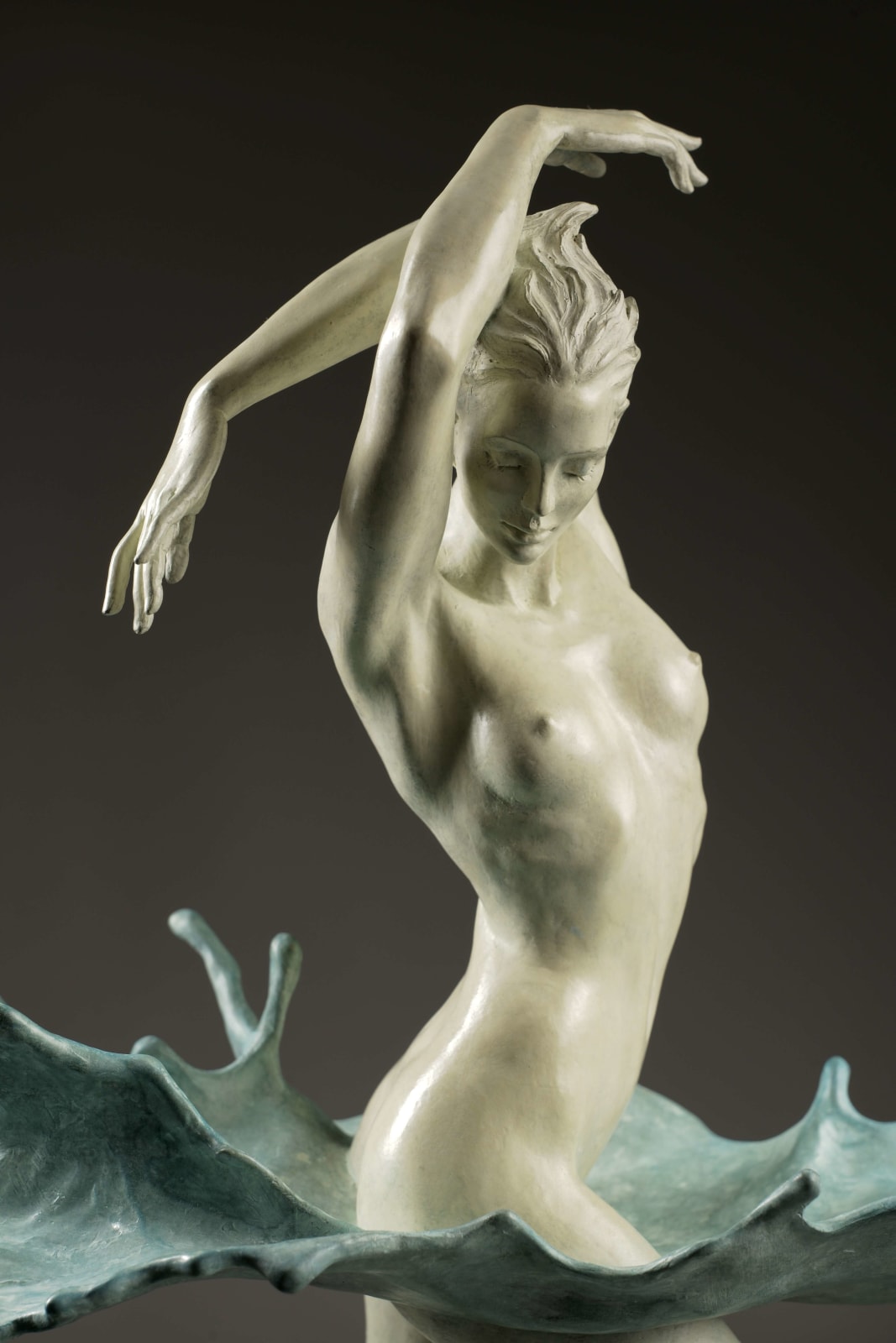 Walking through water contemporary bronze sculpture Liang Binbin Chinese artist green sea water sculpture a beautiful girl swimming or dancing in a big wave sculpture art at Art Yi gallery in Brussels