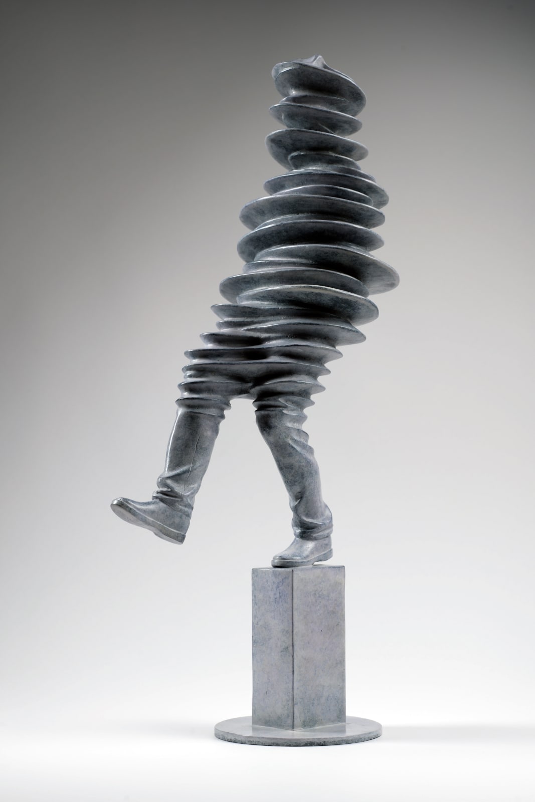 Walkman contemporary sculpture Liang Binbin a light grey bronze sculpture of a man walking and jumping in the rain with shadow figurative sculpture Art Yi gallery Brussels art gallery