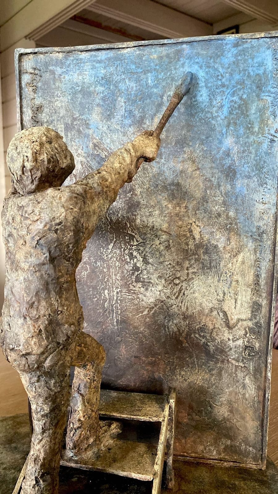 Painting in the sky in his special blue boy sculpture of Lieven D'Haese bronze sculpture figurative contemporary sculpture at Art Yi gallery in Brussels art gallery