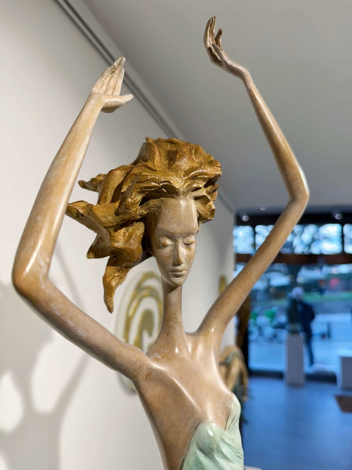 Moonlight dancing girl sculpture of Hedwige Leroux contemporary bronze sculpture dancer woman sculpture a girl in a green dress dancing freely Art Yi gallery in Brussels