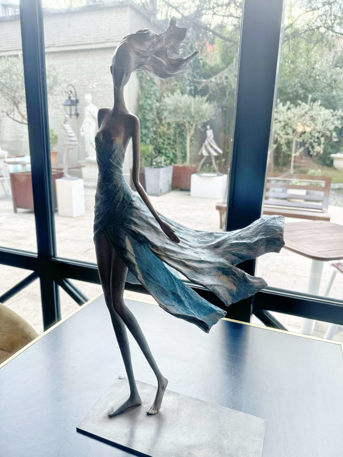 Feelings woman sculpture Hedwige Leroux contemporary sculpture bronze sculpture woman with hair blowing into the wind interior design at hotel Barsey by Warwick Art Yi gallery Brussels art gallery