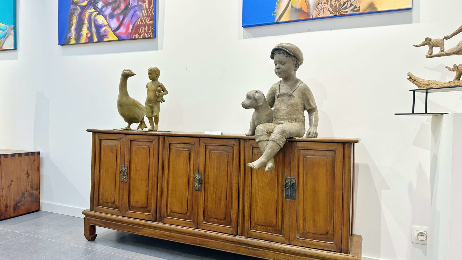 Sylvie Gaudissart child boy sculpture animal sculpture dog sculpture goose sculpture sylvie debray Gaudissart contemporary bronze animal sculpture a boy walking with a big goose friend art gallery of brussels belgian art yi