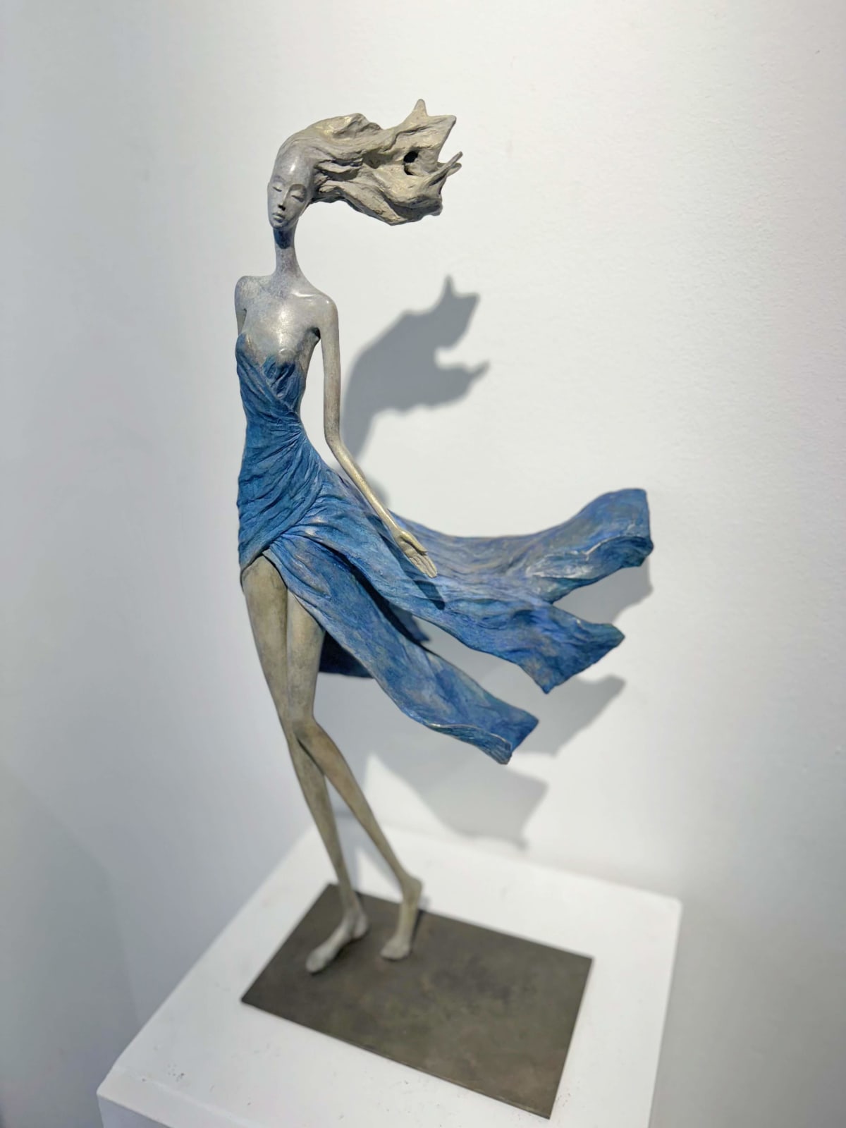 Feelings woman sculpture Hedwige Leroux contemporary sculpture bronze sculpture woman with hair blowing into the wind interior design at hotel Barsey by Warwick Art Yi gallery Brussels art gallery