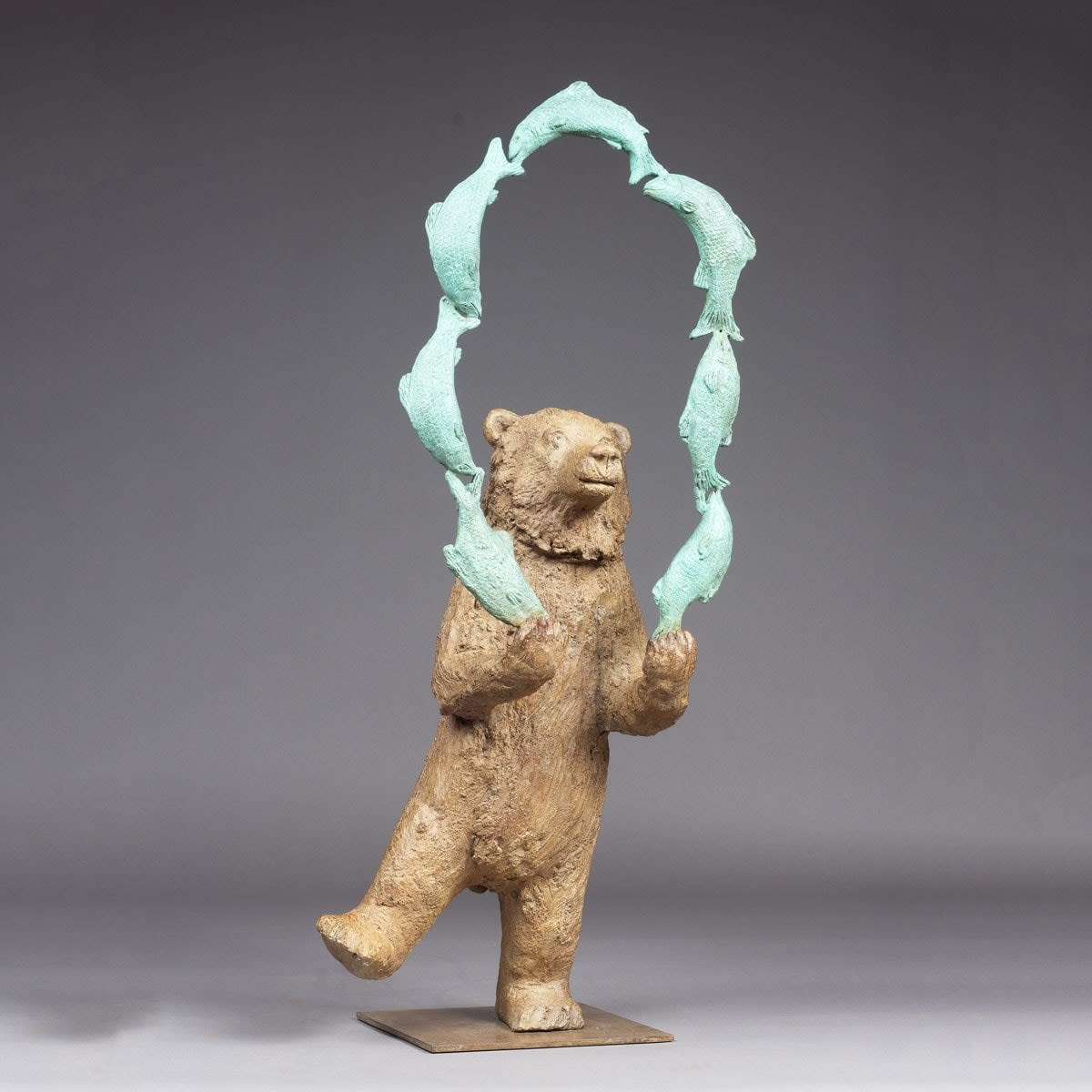 Bear juggling fish cute and adorable bear dancing and fishing animal contemporary bronze bear sculpture sophie verger